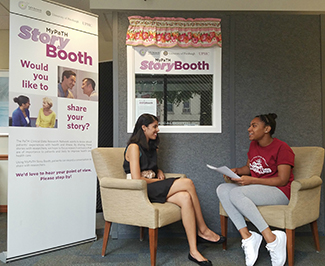 A MyPaTH Story Booth participant sits down with an interviewer to tell their health story.